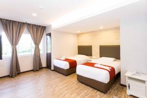 Postel nebo postele na pokoji v ubytování Icon Hotel Segamat