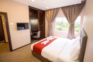 Postel nebo postele na pokoji v ubytování Icon Hotel Segamat