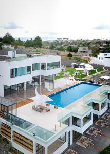 an aerial view of a building with a swimming pool at Ricefield Valley in Mandriankeniheny