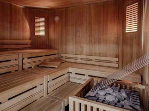 an empty sauna with wooden walls and wooden floors at Apartment Bergsonne in Samnaun