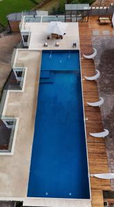 an overhead view of a blue swimming pool at Ricefield Valley in Mandriankeniheny
