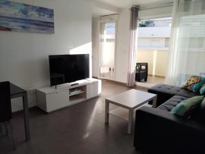 Et tv og/eller underholdning på Super appartement à 200m de la plage à « Portisel »