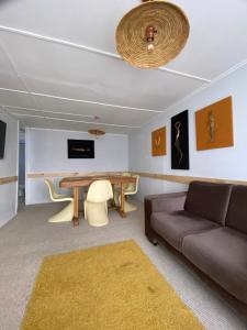 a living room with a couch and a table at Casa Ovejero in Punta Arenas