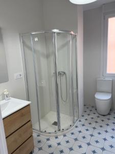 a bathroom with a shower and a toilet at Gran Bilbao LaGa Apartamentos in Basauri +32 photos