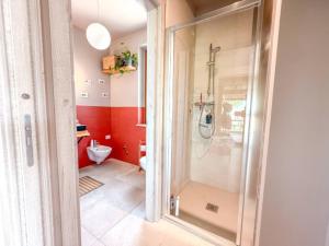 a bathroom with a shower and a toilet at un MONDO A PARTE in Monsampolo del Tronto +20 photos