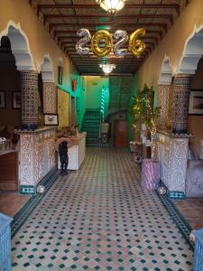 a room with a tile floor in a building at Riad Ouarzazate in Ouarzazate