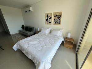 En eller flere senge i et værelse på Reserva del Mar II 821 + 9 billeder