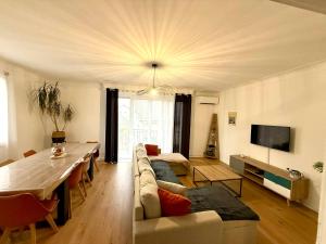 a living room with a couch and a table at Un Mendi in Argelès-Gazost