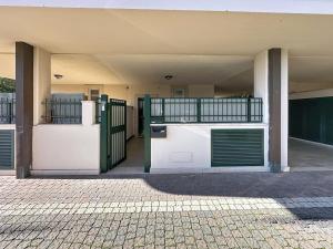an empty building with two gates and a fence at I 3 Moschettieri vicino a Terme e Unitus, Parcheggio libero in Viterbo