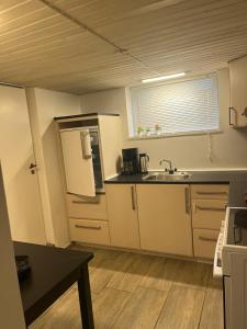 a kitchen with a sink and a counter top at Cozy Corner in Augustenborg