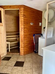 a kitchen with a door open to a refrigerator at Chata Rychnovanka in Zdobnice