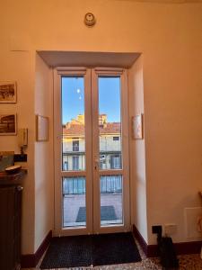 an open door with a view of a building at Fandara Suites in Turin