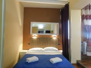 En eller flere senge i et værelse på PICCOLO HOTEL Nel Centro Storico di Firenze