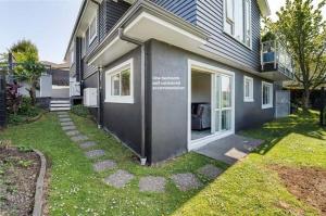 a house with a walkway in front of it at Parkside in Bethlehem in Tauranga
