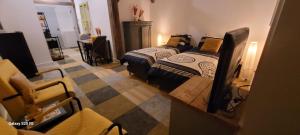 a room with two beds and a tv in it at Bed and Breakfast Reestdal in Meppel