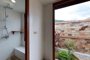 a bathroom with a shower and a brick wall at PingChan Koh Phangan Beachfront Resort in Thong Nai Pan Yai +35 photos