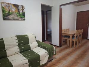 a living room with a couch and a table at Casa Hermosa in São Gabriel