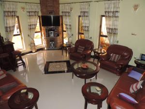 Ο χώρος του lounge ή του μπαρ στο Asimba Guest House