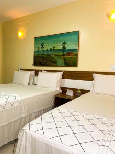 En eller flere senge i et værelse på Hotel Monólitos