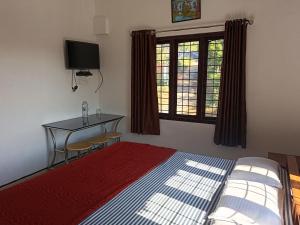 Et tv og/eller underholdning på Thekkekara Budget Rooms