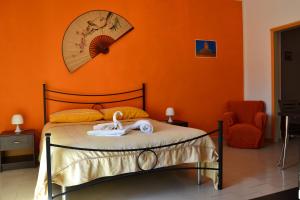 A bed or beds in a room at Casa Vacanze Laura