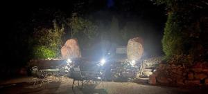 a truck parked in front of a stone wall at night at Ríocht Fódla 2 in Killarney +1 photo