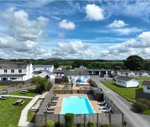 an aerial view of a resort with a swimming pool at Gateway to Cornwall in St Austell