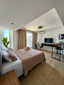 Postel nebo postele na pokoji v ubytování MarDelSuites - Studio Premium Piso 14 a Pasos del Mar, Amenities, Seguridad 24hrs, Cochera Opcional