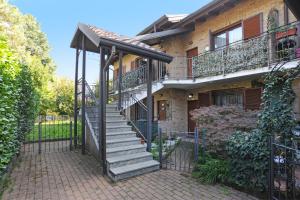 a house with a staircase in front of it at Urban Oasis in Cormano
