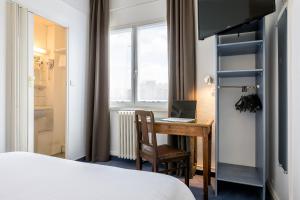 En eller flere senge i et værelse på Hôtel Saint Maurice