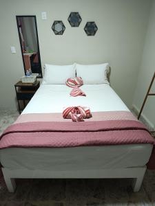 En eller flere senge i et værelse på Suite 103 Cordoba Centro con Estacionamiento