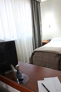 Postel nebo postele na pokoji v ubytování Hotel Desiderio