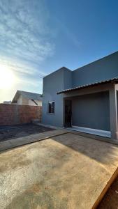 a large building with a driveway in front of it at Casa de praia Cleo in Luis Correia