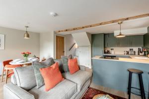 a living room with a couch and a kitchen at 2 Bed in Chapel Stile oc-u32104 in Chapel Stile