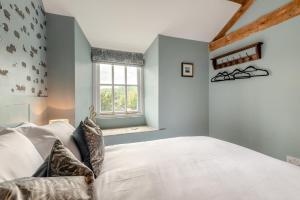 a bedroom with a white bed and a window at 2 Bed in Chapel Stile oc-u32104 in Chapel Stile