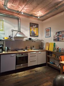 a kitchen with a sink and a stove at the icecream factory, room in private house in York