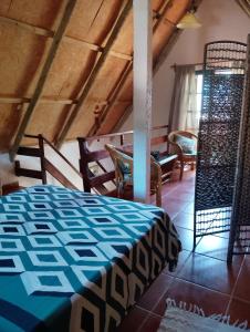 En eller flere senge i et værelse på Cabañas "Las Caracolas"