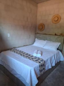 En eller flere senge i et værelse på Yahweh Guriú