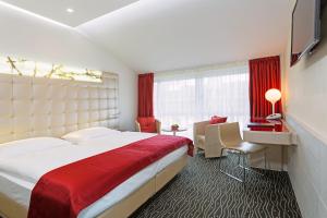 Postelja oz. postelje v sobi nastanitve Hotel St.Gotthard