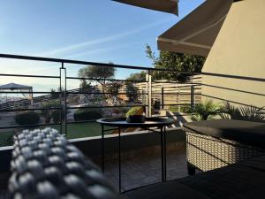 a balcony with a table and a view at addview 2 in Nafplio