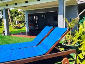a blue hammock in front of a house at Amazing view in Port Vila