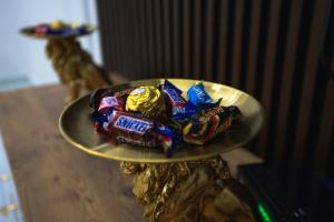a plate of candy bars on a table at Golden Apartment Korce in Korçë +22 photos