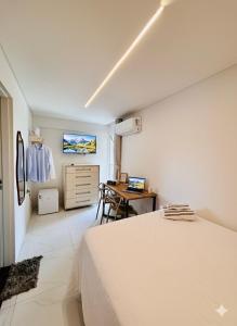 TV a/nebo společenská místnost v ubytování Quarto master Fortaleza Sul