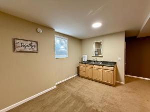 a kitchen with a sink and a counter top at Lake Front Sunset | New Deck | Kayaks | Canoe in Salisbury