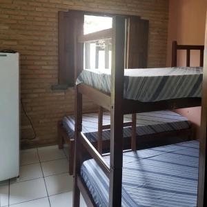 En eller flere senge i et værelse på Pousada Refúgio