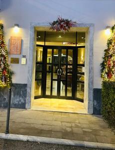 an entrance to a building with a glass door at Art Hotel Pietrasanta in Pietrasanta