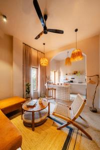 a living room with a couch and a table at ONEOFF X ASSI - A Boutique Homeotel in Varanasi
