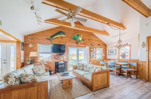 a living room with a couch and a table at This is it - Nags Head MP 16, Ocean View, 75 Yards to Beach, Elevator, Wheelchair Friendly, Flex Stays in Nags Head