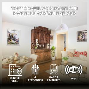 een poster van een woonkamer met een tafel en een bank bij GANZALIESELE in Colmar