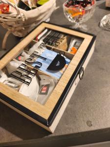 a drawer on top of a table with tools in it at house Benedetta & Gloria on the lake in Castelletto sopra Ticino